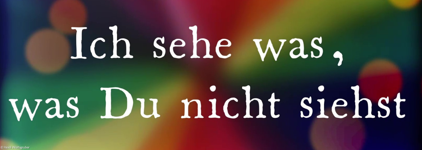 Regenbogenfarbener Hintergrund mit Schriftzug Ich sehe was, was du nicht siehst